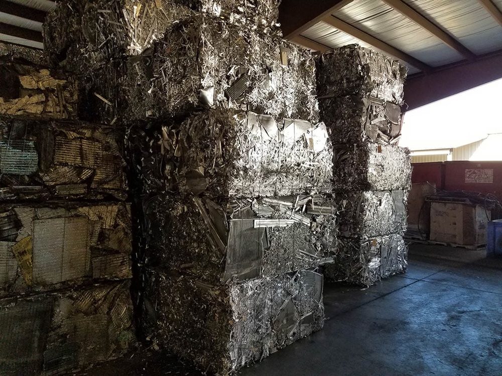 Stacked aluminum bales produced by a two-ram baler